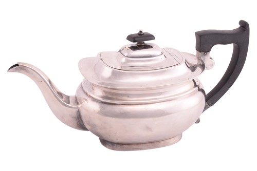Lot 431 - A silver teapot of plain boat form with...