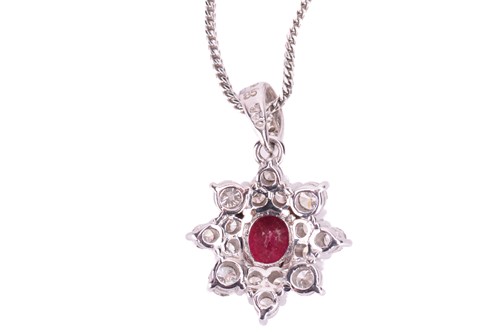 Lot 257 - A ruby and diamond cluster pendant and...