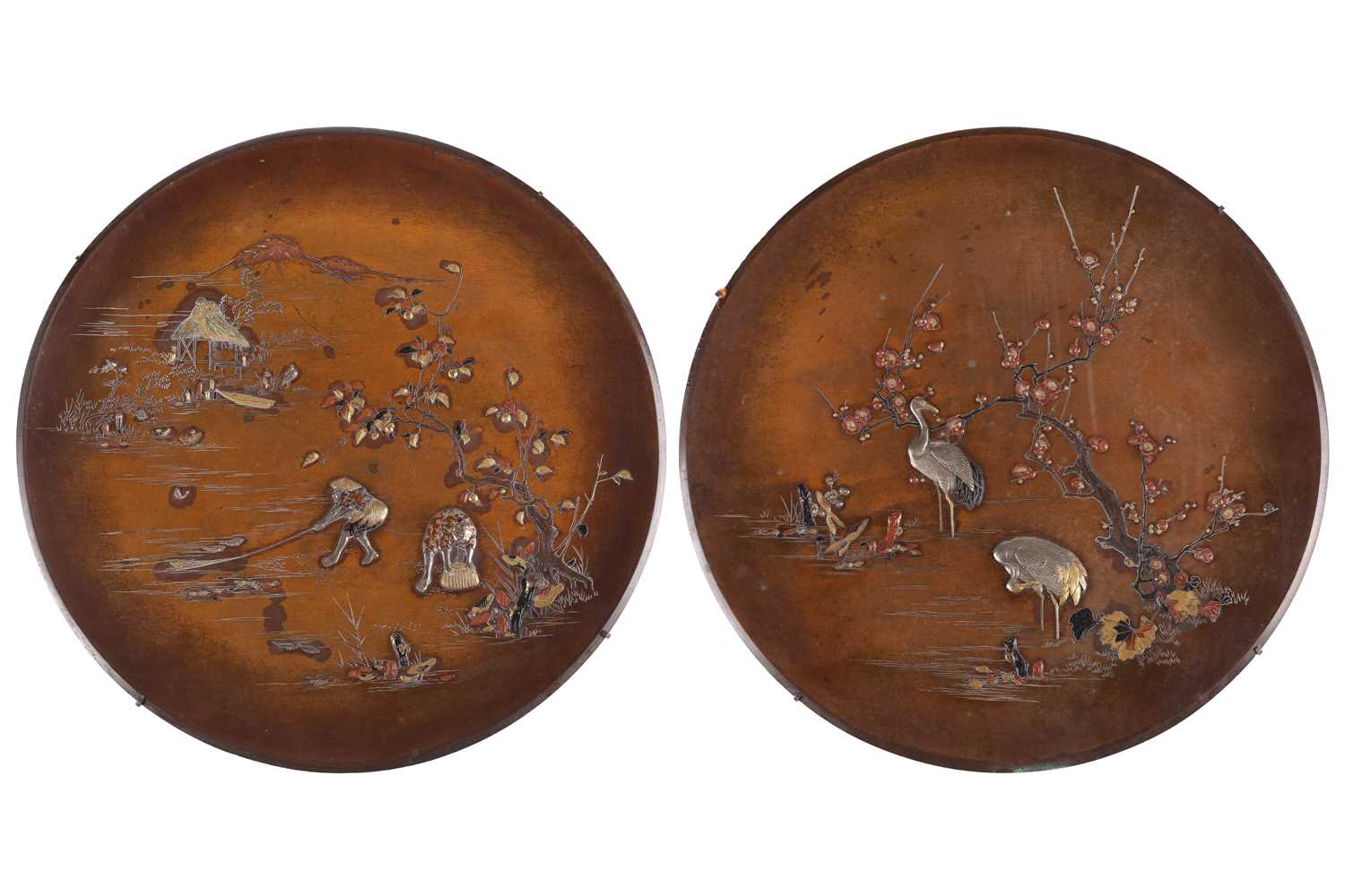Lot 4 - A matched pair of Japanese bronze circular...