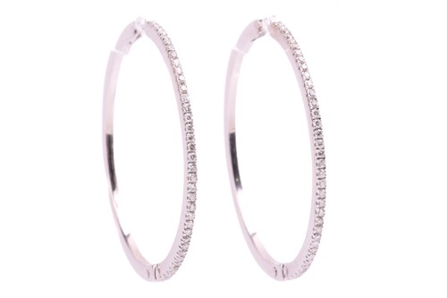 Lot 290 - A pair of diamond hoop earrings, set with 1mm...