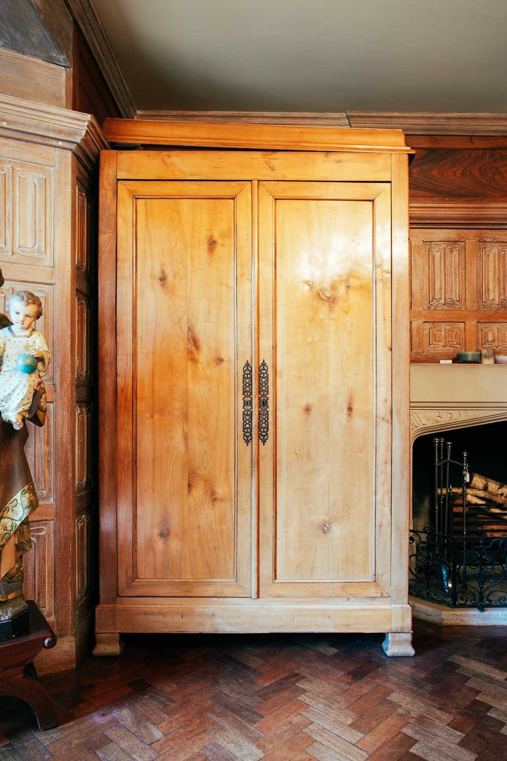 Lot 154 - A 19th century Continental maple armoire, the...