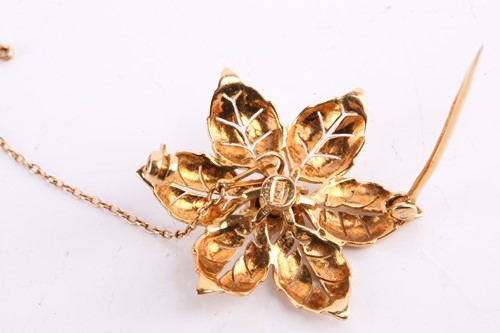 Lot 138 - A diamond brooch in a foliate design set with...