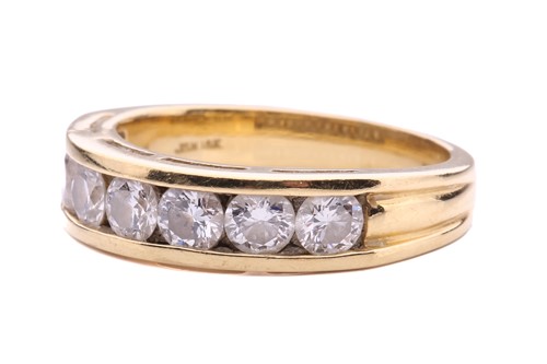 Lot 64 - A seven-stone half-hoop diamond ring, channel...