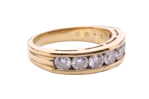 Lot 64 - A seven-stone half-hoop diamond ring, channel...