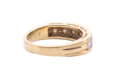 Lot 64 - A seven-stone half-hoop diamond ring, channel...