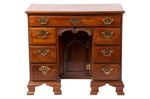 Lot 199 - A George III mahogany kneehole desk, the...