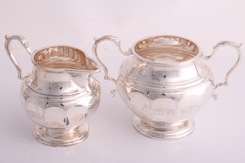 Lot 445 - A three-piece silver tea set by Elkington and...