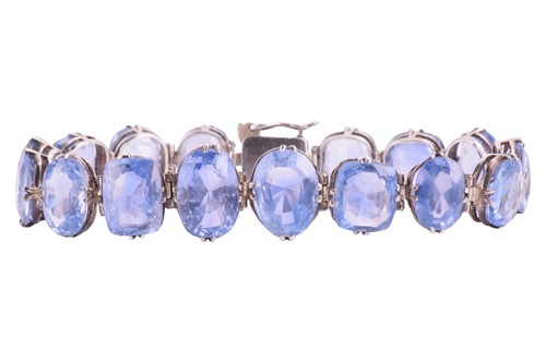 Lot 98 - A Ceylon sapphire bracelet, set with a row of...