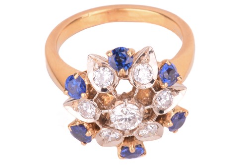 Lot 4 - A diamond and sapphire cluster ring, in a...