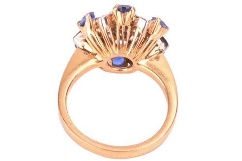 Lot 4 - A diamond and sapphire cluster ring, in a...