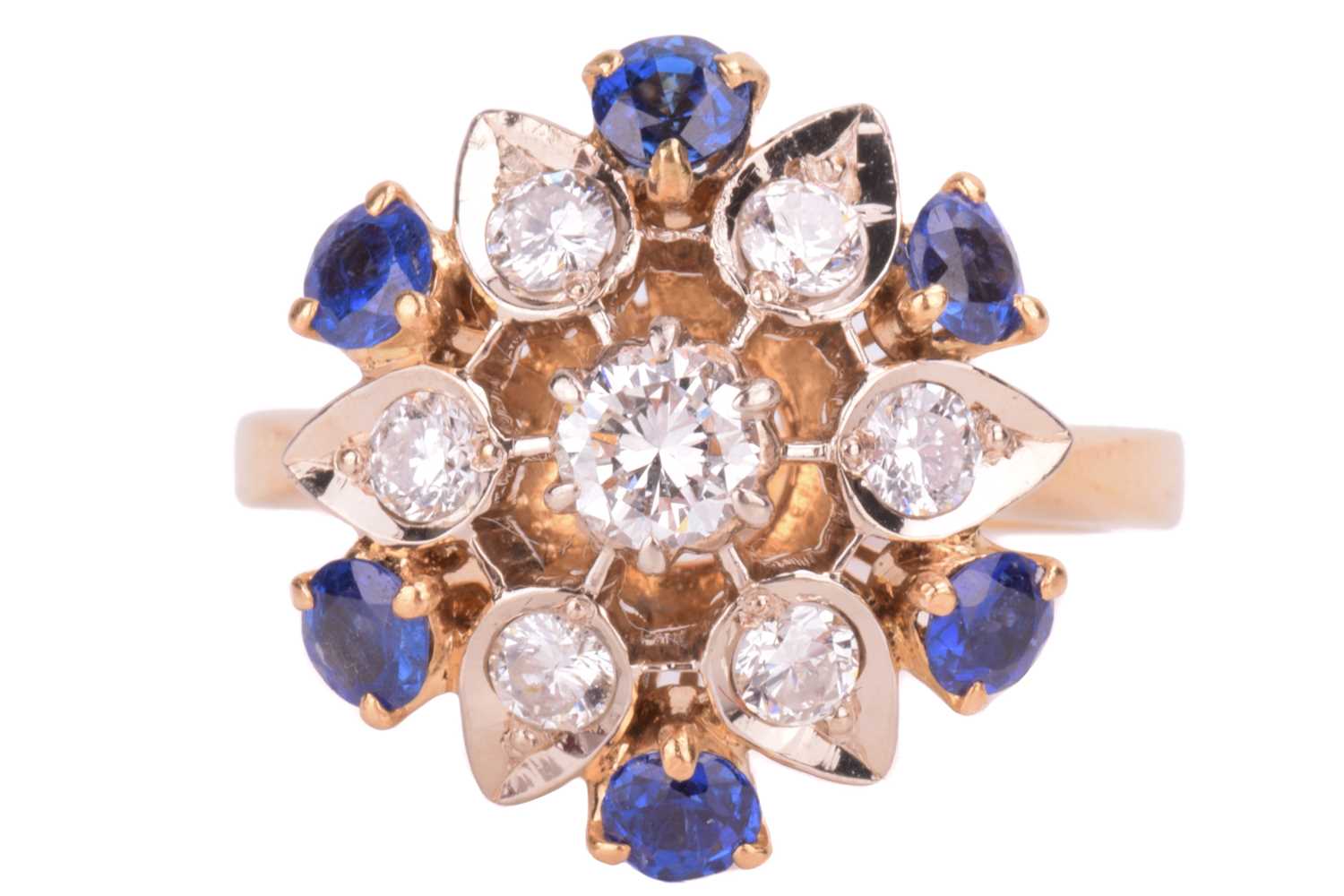 Lot 4 - A diamond and sapphire cluster ring, in a...