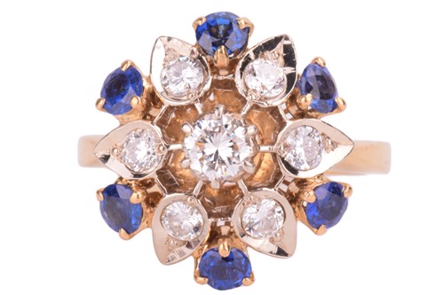 Lot 4 - A diamond and sapphire cluster ring, in a...