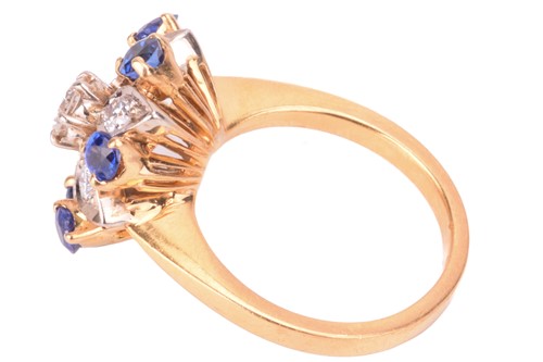 Lot 4 - A diamond and sapphire cluster ring, in a...