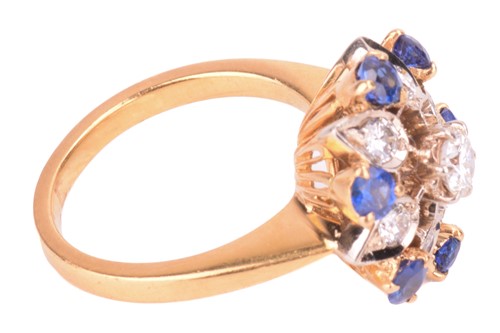 Lot 4 - A diamond and sapphire cluster ring, in a...