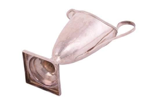 Lot 209 - A George III silver helmet cream jug with a...