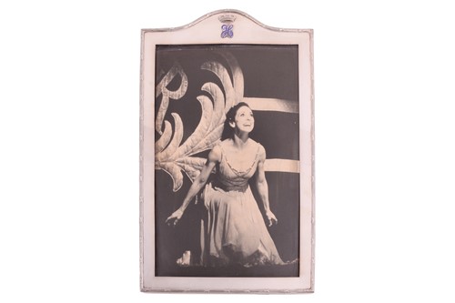 Lot 440 - A large silver photograph frame; arched...