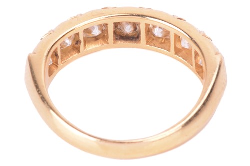 Lot 8 - A diamond half hoop ring, set with a row of...