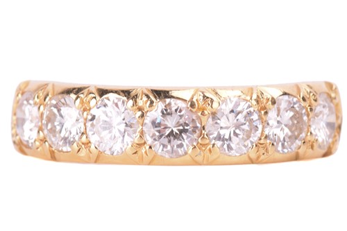 Lot 8 - A diamond half hoop ring, set with a row of...