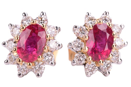 Lot 83 - A pair of ruby and diamond cluster earrings in...