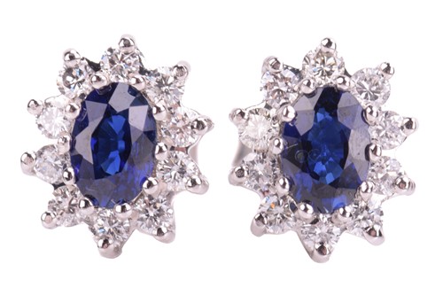 Lot 78 - A pair of sapphire and diamond cluster...