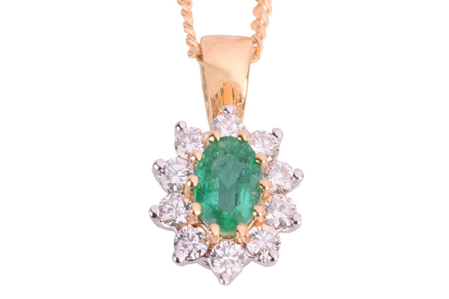 Lot 67 - An emerald and diamond cluster pendant on...