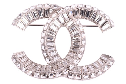 Lot 149 - Chanel. A double C interlocking logo brooch,...