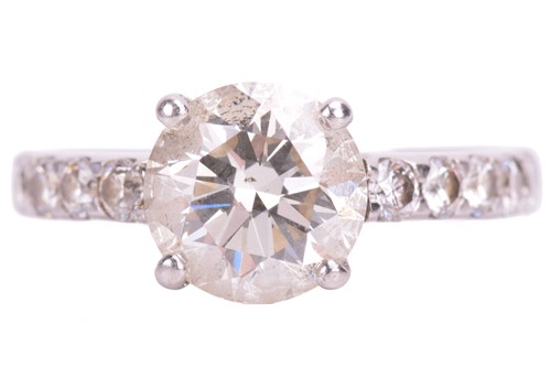 Lot 48 - A single stone diamond ring; the round...