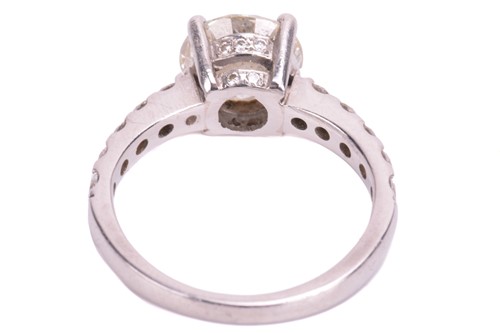 Lot 48 - A single stone diamond ring; the round...