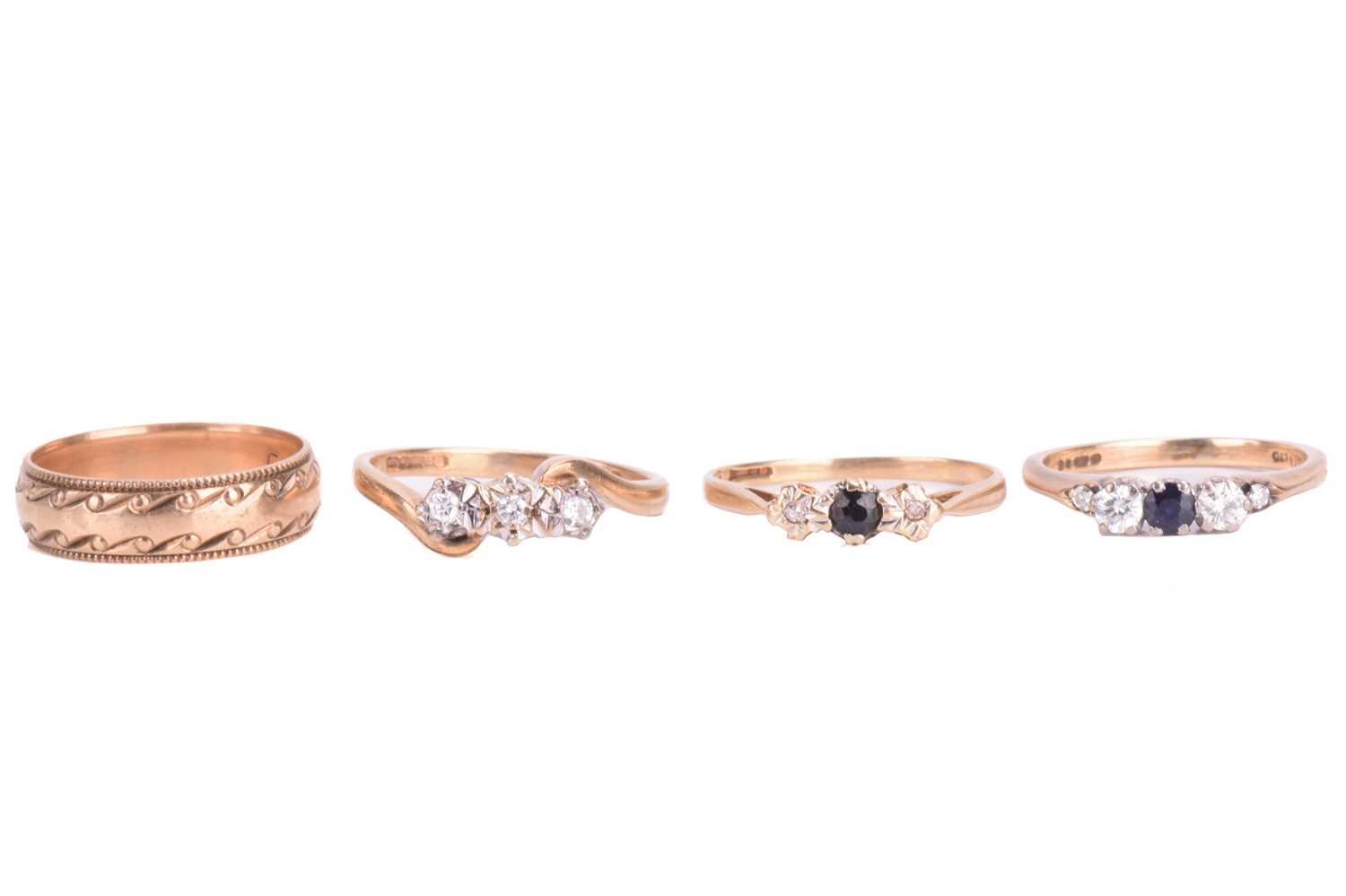 Lot 18 - A collection of four rings; comprising a...