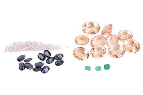 Lot 63 - A collection of loose gemstones, featuring...