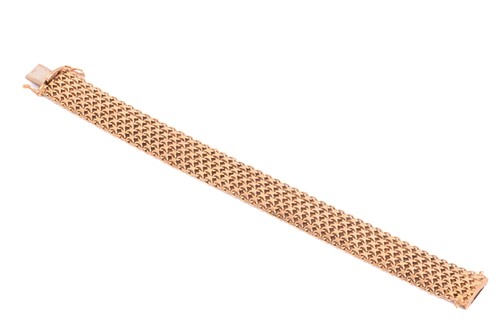 Lot 7 - A gold mesh bracelet, measuring 15.5mm and...