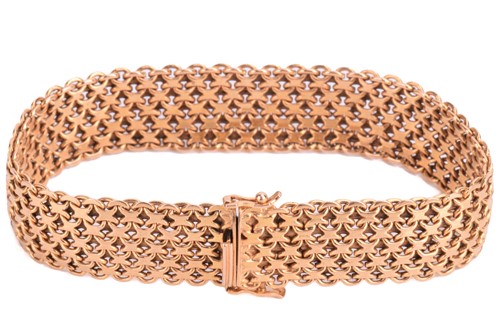 Lot 7 - A gold mesh bracelet, measuring 15.5mm and...