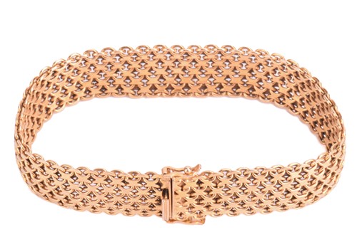 Lot 7 - A gold mesh bracelet, measuring 15.5mm and...