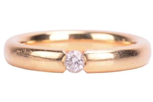 Lot 165 - A diamond set wedding style ring in yellow...
