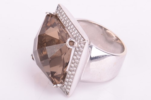 Lot 5 - A smokey quartz and diamond cocktail ring, set...