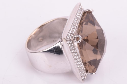 Lot 5 - A smokey quartz and diamond cocktail ring, set...