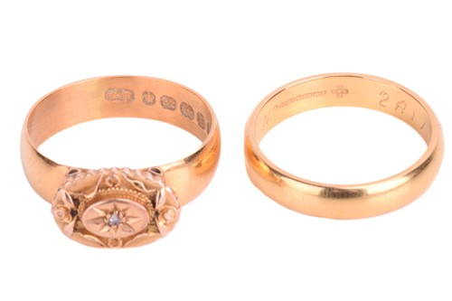 Lot 122 - Two 22ct gold rings. The dress ring is set...