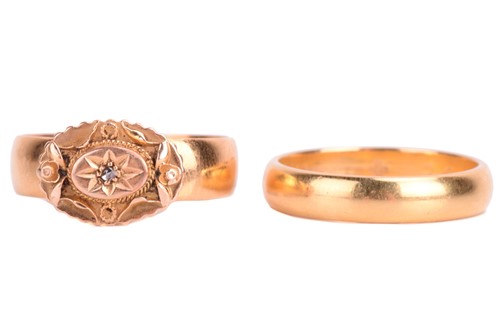 Lot 122 - Two 22ct gold rings. The dress ring is set...