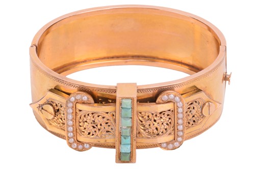 Lot 1 - A Victorian buckle bangle in yellow metal...