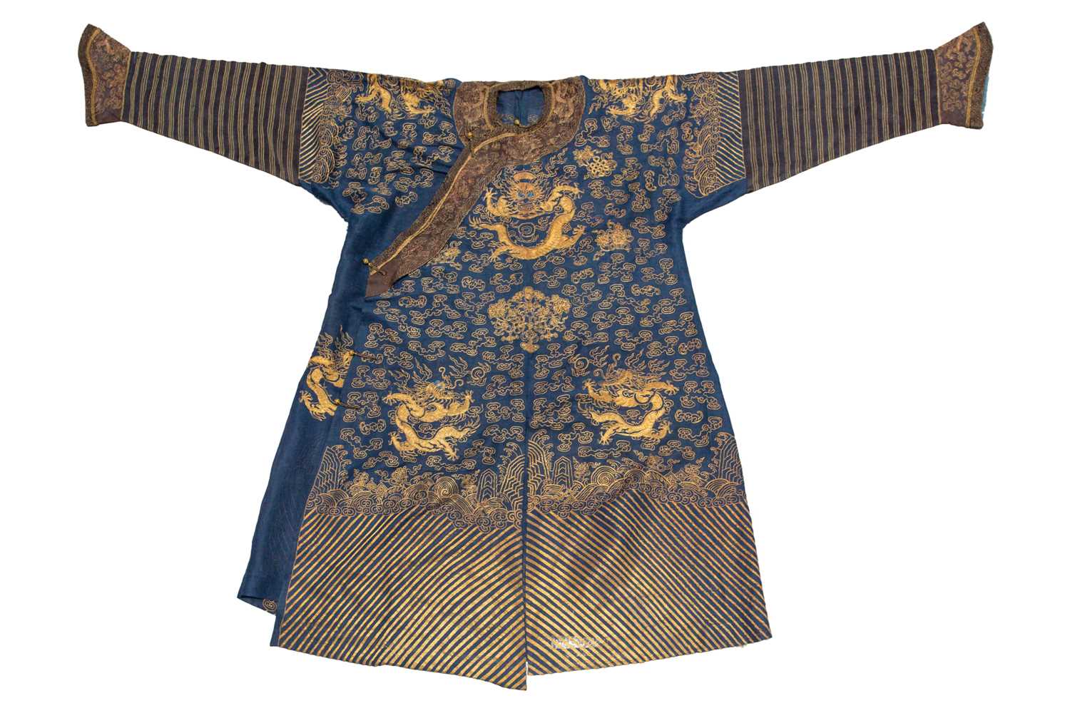 Lot 113 - A Chinese blue silk Jifu nine dragon...