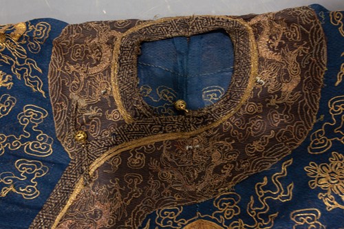 Lot 113 - A Chinese blue silk Jifu nine dragon...