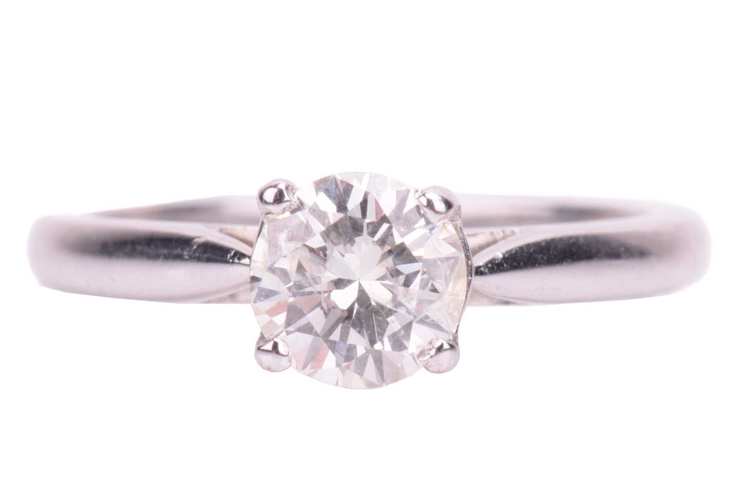 Lot 73 - A solitaire diamond ring, featuring a central...