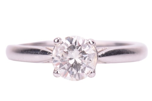 Lot 73 - A solitaire diamond ring, featuring a central...