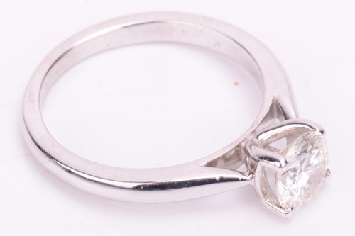 Lot 73 - A solitaire diamond ring, featuring a central...