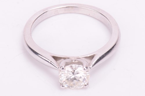 Lot 73 - A solitaire diamond ring, featuring a central...