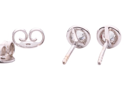 Lot 63 - A pair of diamond stud earrings, each...