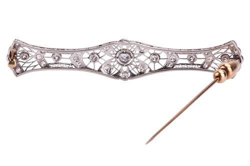 Lot 8 - A diamond-set filigree bar brooch featuring...