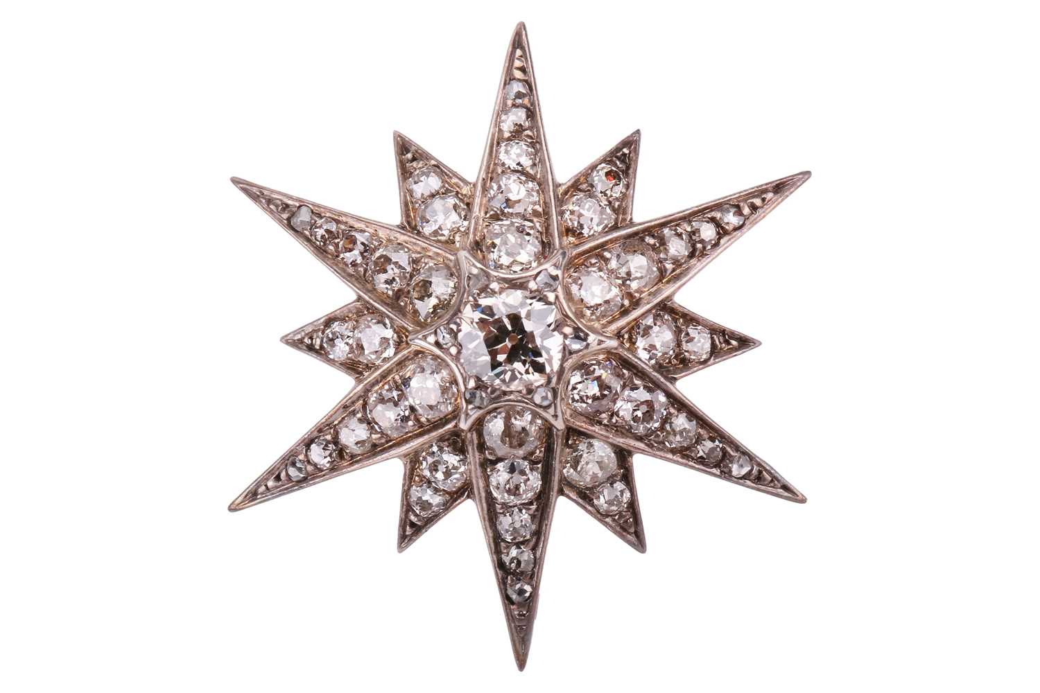 Lot 66 - A Victorian diamond star brooch set throughout...