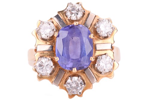 Lot 73 - A tanzanite and diamond cluster ring, the oval...