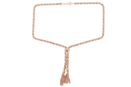 Lot 59 - A bi-colour twisted rope necklace with tassel...
